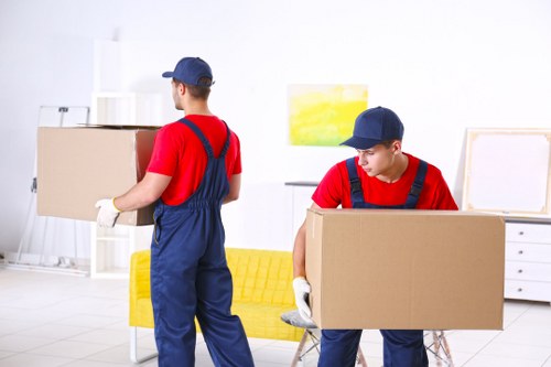 Office relocation planning in Brent with moving team and packed office boxes