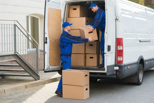 Professional removals and storage service in Brent with moving boxes and furniture