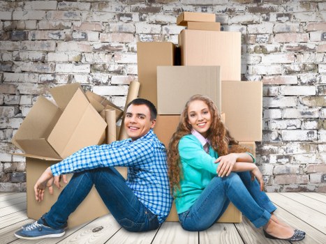 Professional packers preparing household items for a move in Brent
