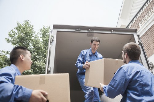 Stacked household furniture in a clean Brent storage facility