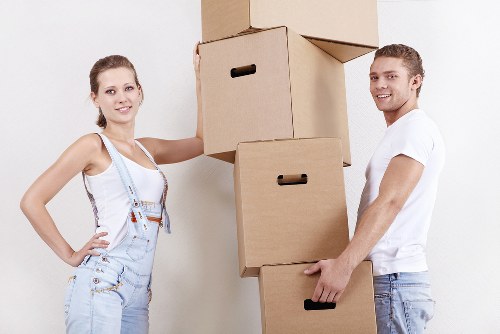 Professional removals team handling furniture during a Brent home move